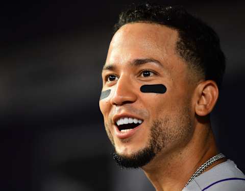 ATLANTA, GA – AUGUST 18: Carlos Gonzalez #5 of the Colorado Rockies celebrates after scoring a 10th inning run against the Atlanta Braves at SunTrust Park on August 18, 2018 in Atlanta, Georgia. (Photo by Scott Cunningham/Getty Images)