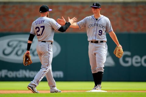 ATLANTA, GA – AUGUST 19: Trevor Story #27 and DJ LeMahieu #9 of the Colorado Rockies celebrate beating the Atlanta Braves at SunTrust Park on August 19, 2018 in Atlanta, Georgia. (Photo by Daniel Shirey/Getty Images)