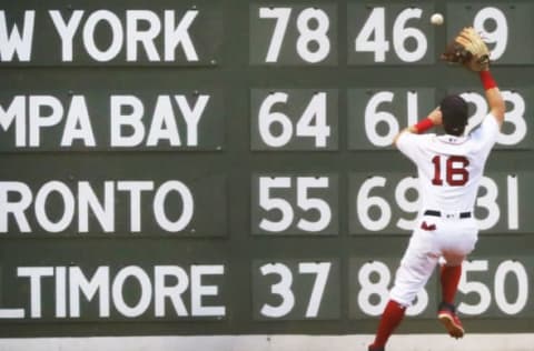 BOSTON, MA – AUGUST 21: Andrew Benintendi #16 of the Boston Red Sox plays a ball off of the Green Monster scoreboard in the first inning of a game against the Cleveland Indians at Fenway Park on August 21, 2018 in Boston, Massachusetts. (Photo by Adam Glanzman/Getty Images)