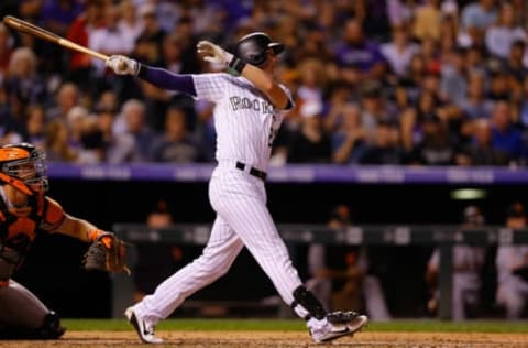 DENVER, CO – SEPTEMBER 4: Ryan McMahon #24 of the Colorado Rockies watches his solo home run to tie the game in the seventh inning as catcher Nick Hundley #5 of the San Francisco Giants looks on at Coors Field on September 4, 2018 in Denver, Colorado. (Photo by Justin Edmonds/Getty Images)