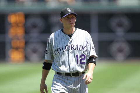 PHILADELPHIA – JULY 26: Shortstop Clint Barmes #12 of the Colorado Rockies warms-up before the game against the Philadelphia Phillies at Citizens Bank Park on July 26, 2010 in Philadelphia, Pennsylvania. The Phillies won 5-4. (Photo by Hunter Martin/Getty Images)