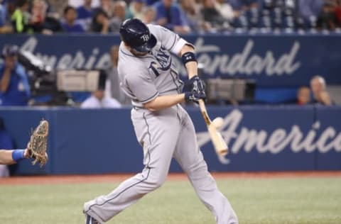 TORONTO, ON – SEPTEMBER 20: C.J. Cron #44 of the Tampa Bay Rays hits a three-run single in the seventh inning during MLB game action against the Toronto Blue Jays at Rogers Centre on September 20, 2018 in Toronto, Canada. (Photo by Tom Szczerbowski/Getty Images)