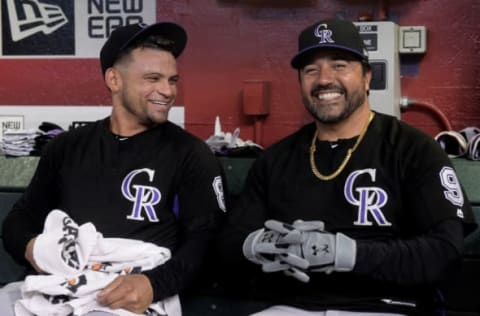 PHOENIX, AZ – SEPTEMBER 21: Gerardo Parra #8 and special assistant to the general manager Vinny Castilla of the Colorado Rockies share a laugh in the dugout before the MLB game against the Arizona Diamondbacks at Chase Field on September 21, 2018, in Phoenix, Arizona. (Photo by Jennifer Stewart/Getty Images)