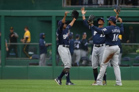 PITTSBURGH, PA – SEPTEMBER 23: Domingo Santana #16 of the Milwaukee Brewers celebrates with Keon Broxton #23 and Curtis Granderson #28 after the final out in a 13-6 win over the Pittsburgh Pirates at PNC Park on September 23, 2018 in Pittsburgh, Pennsylvania. (Photo by Justin Berl/Getty Images)