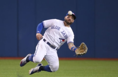 TORONTO, ON – SEPTEMBER 24: Kevin Pillar #11 of the Toronto Blue Jays makes a sliding catch in the eighth inning during MLB game action against the Houston Astros at Rogers Centre on September 24, 2018 in Toronto, Canada. (Photo by Tom Szczerbowski/Getty Images)