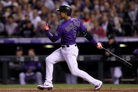 DENVER, CO – SEPTEMBER 26: Carlos Gonzalez #5 of the Colorado Rockies hits an RBI single in the fourth inning against the Philadelphia Phillies at Coors Field on September 26, 2018 in Denver, Colorado. (Photo by Matthew Stockman/Getty Images)