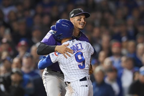 CHICAGO, IL – OCTOBER 02: Javier Baez #9 of the Chicago Cubs hugs Nolan Arenado #28 of the Colorado Rockies in the eleventh inning during the National League Wild Card Game at Wrigley Field on October 2, 2018 in Chicago, Illinois. (Photo by Stacy Revere/Getty Images)