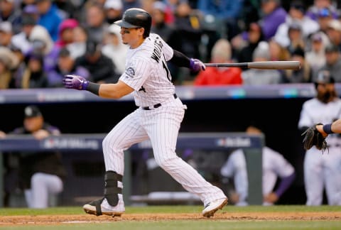 DENVER, CO – OCTOBER 07: Tony Wolters #14 of the Colorado Rockies hits a single in the fifth inning of Game Three of the National League Division Series against the Milwaukee Brewers at Coors Field on October 7, 2018 in Denver, Colorado. (Photo by Justin Edmonds/Getty Images)