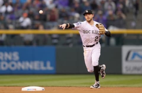 DENVER, CO – OCTOBER 07: Trevor Story #27 of the Colorado Rockies throws out Lorenzo Cain #6 of the Milwaukee Brewers in the seventh inning of Game Three of the National League Division Series at Coors Field on October 7, 2018 in Denver, Colorado. (Photo by Matthew Stockman/Getty Images)