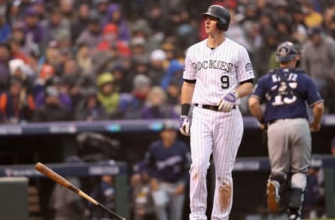 DENVER, CO – OCTOBER 07: DJ LeMahieu #9 of the Colorado Rockies reacts after striking out in the eighth inning of Game Three of the National League Division Series against the Milwaukee Brewers at Coors Field on October 7, 2018 in Denver, Colorado. (Photo by Matthew Stockman/Getty Images)