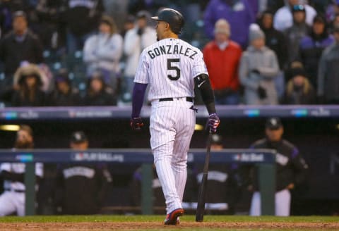 DENVER, CO – OCTOBER 07: Carlos Gonzalez #5 of the Colorado Rockies reacts after striking out during the ninth inning of Game Three of the National League Division Series against the Milwaukee Brewers at Coors Field on October 7, 2018 in Denver, Colorado. (Photo by Justin Edmonds/Getty Images)