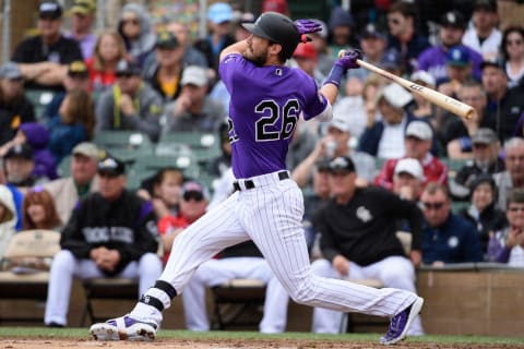 SCOTTSDALE, ARIZONA – MARCH 11: David Dahl #26 of the Colorado Rockies singles during the spring training game against the Oakland Athletics at Salt River Fields at Talking Stick on March 11, 2019 in Scottsdale, Arizona. (Photo by Jennifer Stewart/Getty Images)