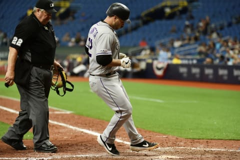 ST PETERSBURG, FLORIDA – APRIL 03: Chris Iannetta #22 of the Colorado Rockies touches home plate after hitting a homer off of Chaz Roe #52 of the Tampa Bay Rays in the 11th inning at Tropicana Field on April 03, 2019 in St Petersburg, Florida. The Rockies won 1-0. (Photo by Julio Aguilar/Getty Images)