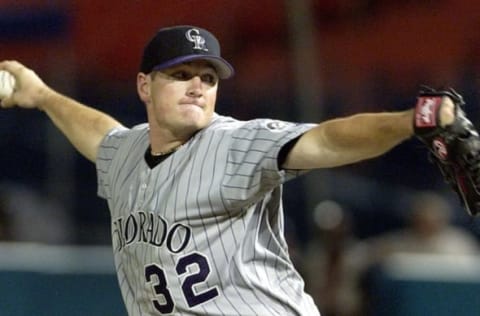 Colorado Rockies’ pitcher Jason Jennings delivers a pitch to Florida Marlins’ outfielder Preston Wilson During sixth inning action 12 August, 2002, at Pro Player Stadium in Miami Florida. AFP PHOTO/RHONA WISE (Photo by RHONA WISE / AFP) (Photo credit should read RHONA WISE/AFP via Getty Images)