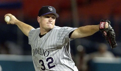 Colorado Rockies’ pitcher Jason Jennings delivers a pitch to Florida Marlins’ outfielder Preston Wilson During sixth inning action 12 August, 2002, at Pro Player Stadium in Miami Florida. AFP PHOTO/RHONA WISE (Photo by RHONA WISE / AFP) (Photo credit should read RHONA WISE/AFP via Getty Images)