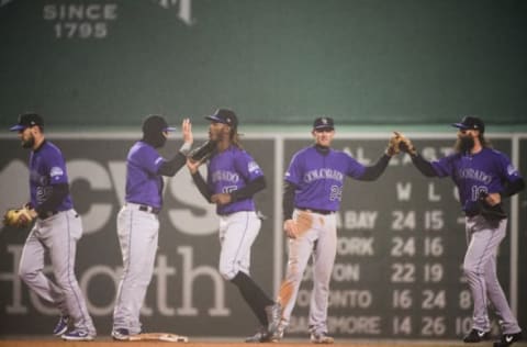 BOSTON, MA – MAY 14: Charle Blackmon #19 and Raimel Tapia #15 celebrate with teammate Ryan McMahon #24 of the Colorado Rockies after beating the Boston Red Sox at Fenway Park on May 14, 2019 in Boston, Massachusetts. (Photo by Kathryn Riley /Getty Images)