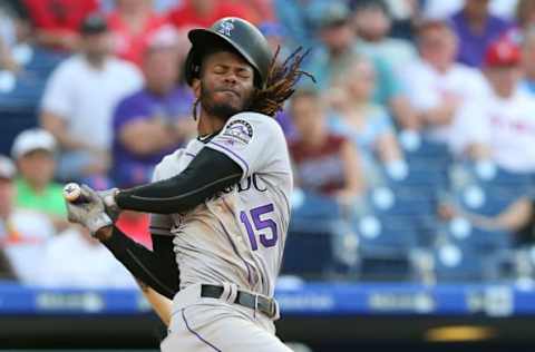 PHILADELPHIA, PA – MAY 18: Raimel Tapia #15 of the Colorado Rockies swings as his helmet comes off his head against the Philadelphia Phillies during the eighth inning of a game at Citizens Bank Park on May 18, 2019 in Philadelphia, Pennsylvania. The Phillies defeated the Rockies 2-1. (Photo by Rich Schultz/Getty Images)