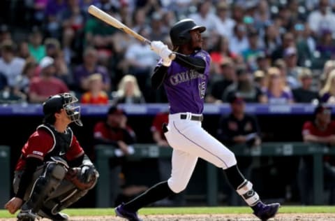 DENVER, COLORADO – MAY 05: Raimel Tapia the Colorado Rockies hits a 3 RBI triple in the eighth inning against the Arizona Diamondbacks at Coors Field on May 05, 2019 in Denver, Colorado. (Photo by Matthew Stockman/Getty Images)