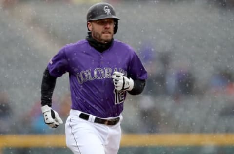 DENVER, COLORADO – MAY 09: Mark Reynolds #12 of the Colorado Rockies circles the bases after hitting a solo home run in the first inning against the San Francisco Giants at Coors Field on May 09, 2019 in Denver, Colorado. (Photo by Matthew Stockman/Getty Images)