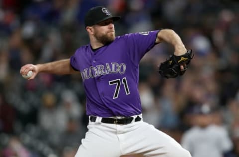 DENVER, COLORADO – MAY 11: Pitcher Wade Davis #71 of the Colorado Rockies throws in the ninth inning against the San Diego Padres at Coors Field on May 11, 2019 in Denver, Colorado. (Photo by Matthew Stockman/Getty Images)