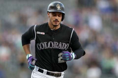 DENVER, COLORADO – MAY 24: Nolan Arenado #28 of the Colorado Rockies circles the bases after hitting a solo home run in the first inning against the Baltimore Orioles at Coors Field on May 24, 2019 in Denver, Colorado. (Photo by Matthew Stockman/Getty Images)