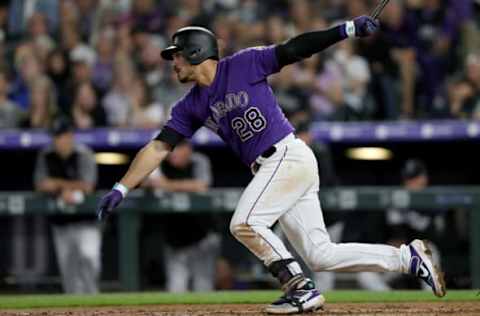 DENVER, COLORADO – MAY 25: Nolan Arenado #28 of the Colorado Rockies hits a RBI single in the fifth inning against the Baltimore Orioles at Coors Field on May 25, 2019 in Denver, Colorado. (Photo by Matthew Stockman/Getty Images)