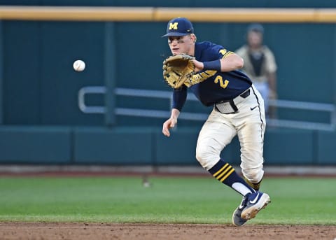 OMAHA, NE – JUNE 26: Jack Blomgren #2 of the Michigan Wolverines fields a ground ball in the eighth inning against the Vanderbilt Commodores during game three of the College World Series Championship Series on June 26, 2019 at TD Ameritrade Park Omaha in Omaha, Nebraska. (Photo by Peter Aiken/Getty Images)