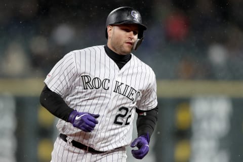 DENVER, COLORADO – MAY 28: Chris Iannetta #22 of the Colorado Rockies circles the bases to score after hitting a 2 RBI home run in the seventh inning against the Arizona Diamondbacks at Coors Field on May 28, 2019 in Denver, Colorado. (Photo by Matthew Stockman/Getty Images)