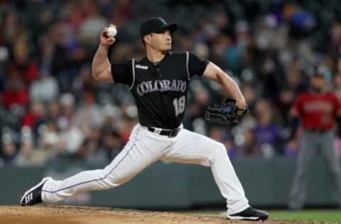 DENVER, COLORADO – MAY 29: Pitcher Seunghwan Oh #18 of the Colorado Rockies throws in the sixth inning against the Arizona Diamondbacks at Coors Field on May 29, 2019 in Denver, Colorado. (Photo by Matthew Stockman/Getty Images)