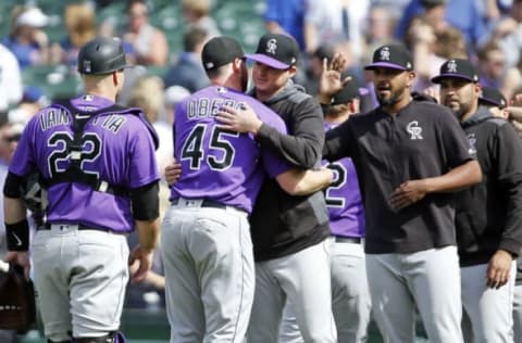 CHICAGO, ILLINOIS – JUNE 06: Scott Oberg #45 of the Colorado Rockies gets a hug from Peter Lambert #23 following their team’s 3-1 win over the Chicago Cubs at Wrigley Field on June 06, 2019 in Chicago, Illinois. (Photo by Nuccio DiNuzzo/Getty Images)