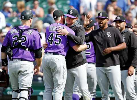 CHICAGO, ILLINOIS – JUNE 06: Scott Oberg #45 of the Colorado Rockies gets a hug from Peter Lambert #23 following their team’s 3-1 win over the Chicago Cubs at Wrigley Field on June 06, 2019 in Chicago, Illinois. (Photo by Nuccio DiNuzzo/Getty Images)