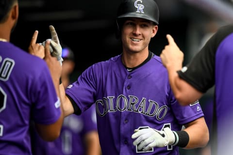 DENVER, CO – JULY 15: Ryan McMahon #24 of the Colorado Rockies is congratulated in the dugout after hitting a seventh inning solo homer against the San Francisco Giants during game one of a doubleheader at Coors Field on July 15, 2019 in Denver, Colorado. (Photo by Dustin Bradford/Getty Images)