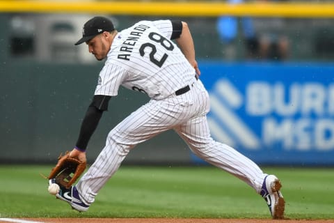 DENVER, CO – JULY 15: Nolan Arenado #28 of the Colorado Rockies fields a ground ball at third base in the first inning during game two of a doubleheader against the San Francisco Giants at Coors Field on July 15, 2019 in Denver, Colorado. (Photo by Dustin Bradford/Getty Images)