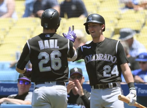 LOS ANGELES, CALIFORNIA – JUNE 23: David Dahl #26 of the Colorado Rockies celebrates his solo homerun with Ryan McMahon #24, to take a 1-0 lead over the Los Angeles Dodgers, during the first inning at Dodger Stadium on June 23, 2019 in Los Angeles, California. (Photo by Harry How/Getty Images)