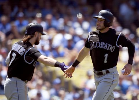 LOS ANGELES, CALIFORNIA – JUNE 23: Garrett Hampson #1 of the Colorado Rockies celebrates his run with Brendan Rodgers #7 from a Ryan McMahon #24 single, to take a 2-0 lead, during the third inning at Dodger Stadium on June 23, 2019 in Los Angeles, California. (Photo by Harry How/Getty Images)