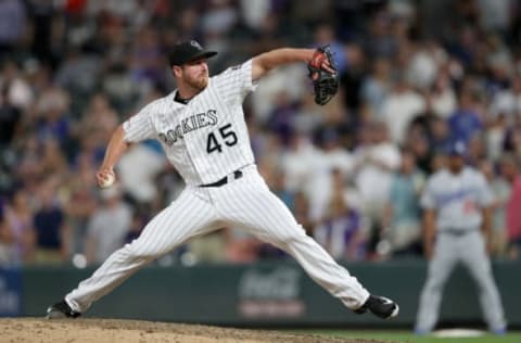 DENVER, COLORADO – JUNE 28: Pitcher Scott Oberg #45 of the Colorado Rockies throws in the ninth inning against the Los Angeles Dodgers at Coors Field on June 28, 2019 in Denver, Colorado. (Photo by Matthew Stockman/Getty Images)