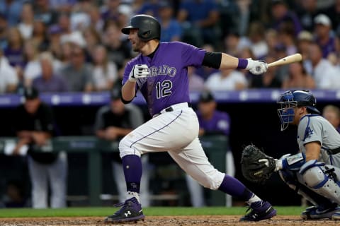 DENVER, COLORADO – JUNE 29: Mark Reynolds #12 of the Colorado Rockies hits a 2 RBI single in the sixth inning against the Los Angeles Dodgers at Coors Field on June 29, 2019 in Denver, Colorado. (Photo by Matthew Stockman/Getty Images)