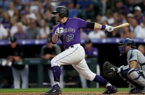 DENVER, COLORADO – JUNE 29: Mark Reynolds #12 of the Colorado Rockies hits a 2 RBI single in the sixth inning against the Los Angeles Dodgers at Coors Field on June 29, 2019 in Denver, Colorado. (Photo by Matthew Stockman/Getty Images)