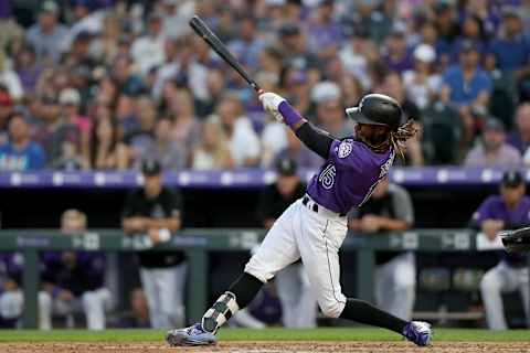 DENVER, COLORADO – JUNE 29: Raimel Tapia #15 of the Colorado Rockies hits a single in the sixth inning against the Los Angeles Dodgers at Coors Field on June 29, 2019 in Denver, Colorado. (Photo by Matthew Stockman/Getty Images)