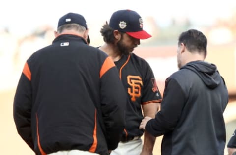 SAN FRANCISCO, CALIFORNIA – JULY 06: Madison Bumgarner #40 of the San Francisco Giants is looked at by head athletic trainer Dave Groeschnerat and manager Bruce Bochy after he was hit by a line drive hit by Jose Martinez #38 of the St. Louis Cardinals in the first inning Oracle Park on July 06, 2019 in San Francisco, California. (Photo by Ezra Shaw/Getty Images)