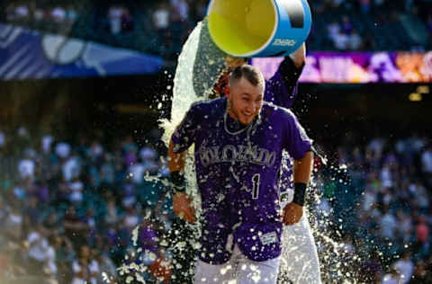 DENVER, CO – AUGUST 18: Garrett Hampson #1 of the Colorado Rockies is doused with Powerade by Charlie Blackmon #19 after hitting a 10th inning walk-off sacrifice fly to go ahead of the Miami Marlins at Coors Field on August 18, 2019 in Denver, Colorado. (Photo by Dustin Bradford/Getty Images)