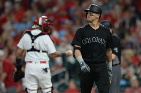 ST. LOUIS, MO – AUGUST 23: Dom Nunez #58 of the Colorado Rockies reacts after striking out in the seventh inning against the St. Louis Cardinals at Busch Stadium on August 23, 2019 in St. Louis, Missouri. Teams are wearing special color schemed uniforms with players choosing nicknames to display for Players’ Weekend. (Photo by Michael B. Thomas/Getty Images)