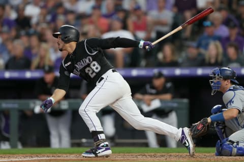 DENVER, COLORADO – JULY 29: Nolan Arenado #28 of the Colorado Rockies hits a 2 RBI single in the fifth inning against the Los Angeles Dodgers at Coors Field on July 29, 2019 in Denver, Colorado. (Photo by Matthew Stockman/Getty Images)