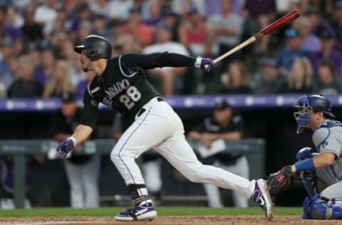 DENVER, COLORADO – JULY 29: Nolan Arenado #28 of the Colorado Rockies hits a 2 RBI single in the fifth inning against the Los Angeles Dodgers at Coors Field on July 29, 2019 in Denver, Colorado. (Photo by Matthew Stockman/Getty Images)