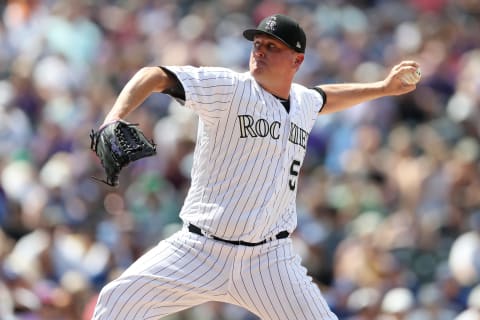 DENVER, COLORADO – JULY 31: Pitcher Jake McGee #51 of the Colorado Rockies throws in the seventh inning against the Los Angeles Dodgers at Coors Field on July 31, 2019 in Denver, Colorado. (Photo by Matthew Stockman/Getty Images)