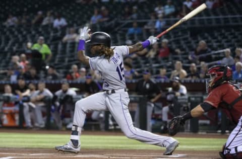 PHOENIX, ARIZONA – AUGUST 21: Raimel Tapia #15 of the Colorado Rockies singles in the first inning of the MLB game against the Arizona Diamondbacks at Chase Field on August 21, 2019 in Phoenix, Arizona. (Photo by Jennifer Stewart/Getty Images)