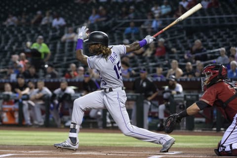 PHOENIX, ARIZONA – AUGUST 21: Raimel Tapia #15 of the Colorado Rockies singles in the first inning of the MLB game against the Arizona Diamondbacks at Chase Field on August 21, 2019 in Phoenix, Arizona. (Photo by Jennifer Stewart/Getty Images)