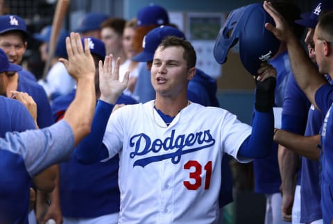 LOS ANGELES, CALIFORNIA – SEPTEMBER 02: Joc Pederson #31 of the Los Angeles Dodgers celebrates in the dugout after scoring in the second inning of the MLB game against the Colorado Rockies at Dodger Stadium on September 02, 2019 in Los Angeles, California. The Dodgers defeated the Rockies 16-9. (Photo by Victor Decolongon/Getty Images)