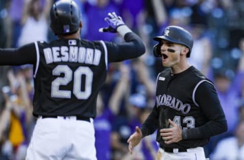 DENVER, CO – SEPTEMBER 29: Sam Hilliard #43 of the Colorado Rockies reacts to scoring in the 13th inning against the Milwaukee Brewers as Ian Desmond #20 of the Colorado Rockies congratulates him at Coors Field on September 29, 2019 in Denver, Colorado. Colorado won 4-3 in 13 innings. (Photo by Joe Mahoney/Getty Images)