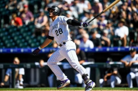 DENVER, CO – SEPTEMBER 1: Nolan Arenado #28 of the Colorado Rockies follows the flight of a sixth inning solo home run against the Pittsburgh Pirates at Coors Field on September 1, 2019 in Denver, Colorado. (Photo by Dustin Bradford/Getty Images)